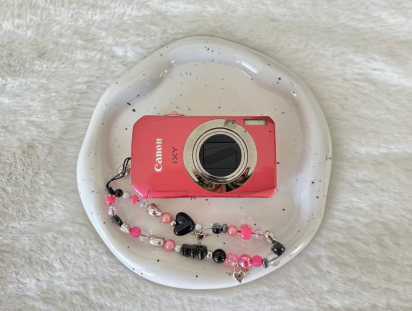 Canon pink Ixy50S digital camera